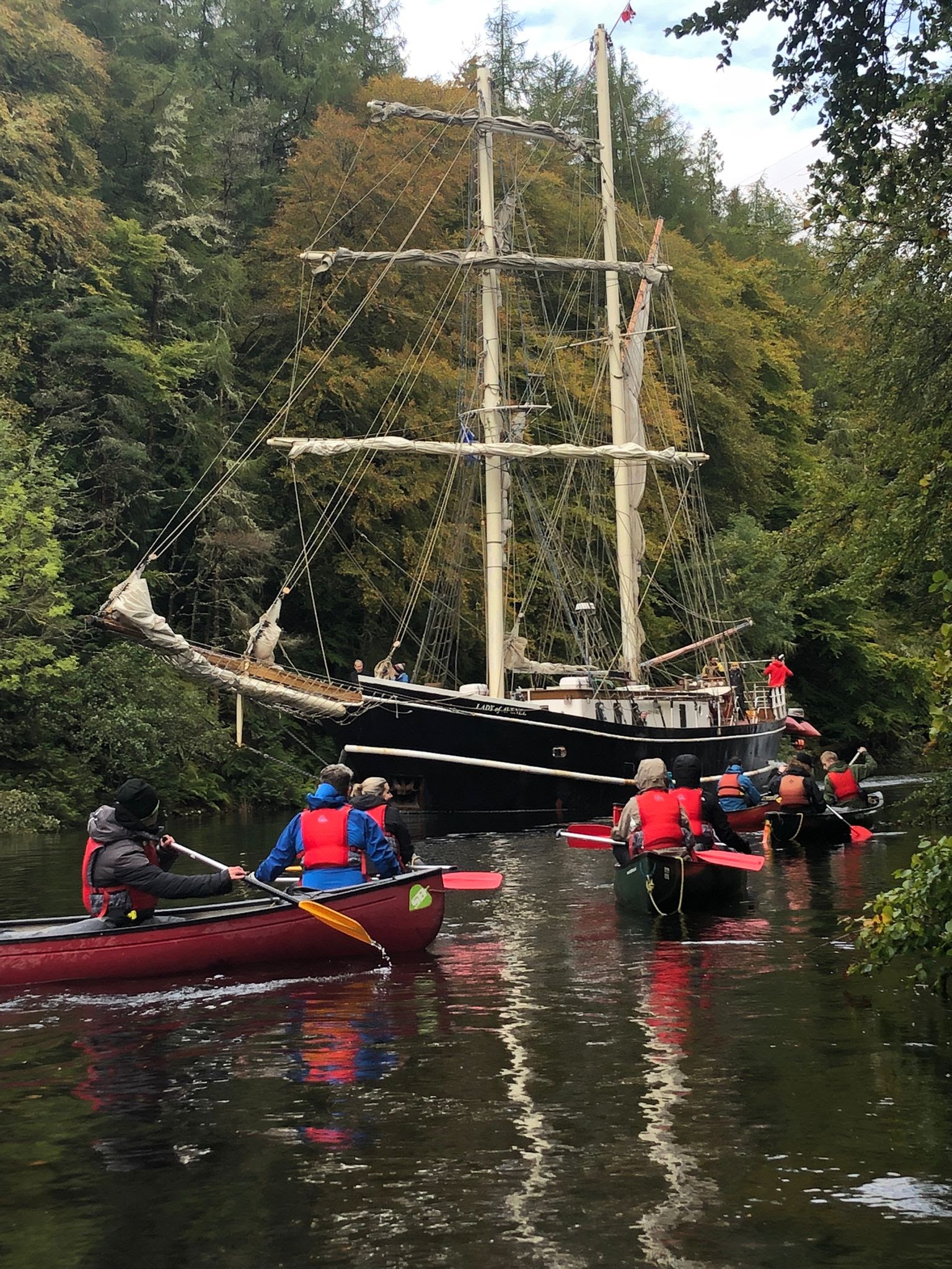 Tall ship and canoes